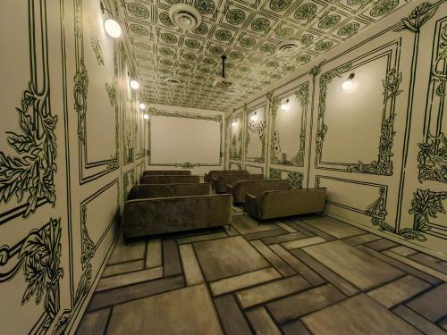 a rendering of a waiting room with chairs and a ceiling at 2811 SECRT Sabana Hermoso Estudio in San José
