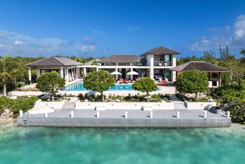 an aerial view of a resort with a swimming pool at The essence of fun under a tropical sun villa in Leeward