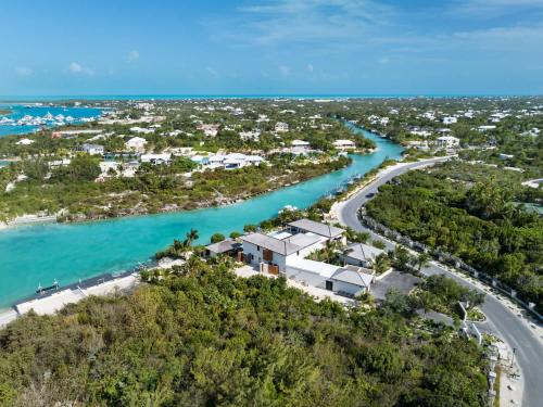 an aerial view of a resort and a river at The essence of fun under a tropical sun villa in Leeward