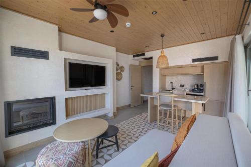a living room with a couch and a fireplace at Radisson Blu Hotel, Kas in Kas
