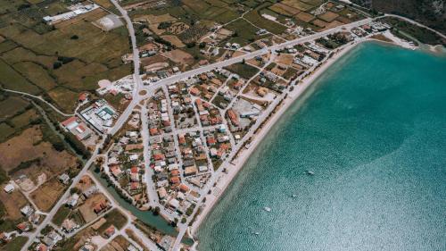 an aerial view of a city next to the water at KK Rooms in Plataria