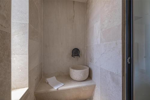 a bathroom with a shower with a toilet in it at Radisson Blu Hotel, Kas in Kas