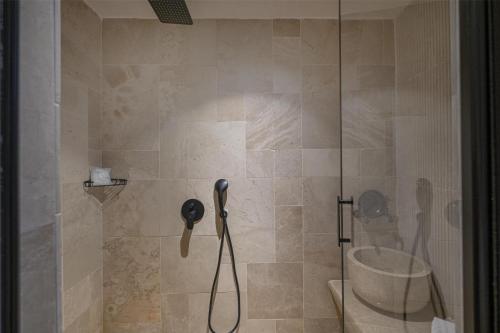 a shower with a phone in a bathroom at Radisson Blu Hotel, Kas in Kas