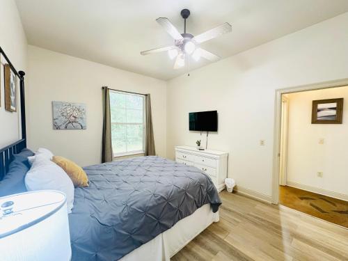 a bedroom with a bed and a ceiling fan at Chateau 6 in Hammond