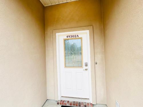 a white door with a address on the side of a house at Chateau 6 in Hammond