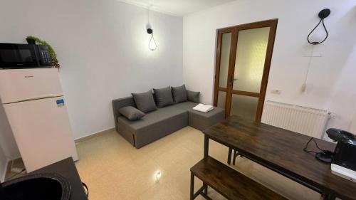 a living room with a couch and a table at Studio Poiana Brasov in Poiana Brasov