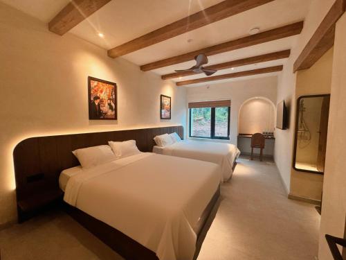 Ένα ή περισσότερα κρεβάτια σε δωμάτιο στο Chimney hotel Mang Den