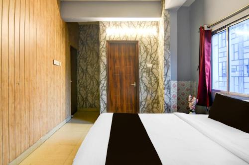 Postel nebo postele na pokoji v ubytování Hotel O Plaza 2.0