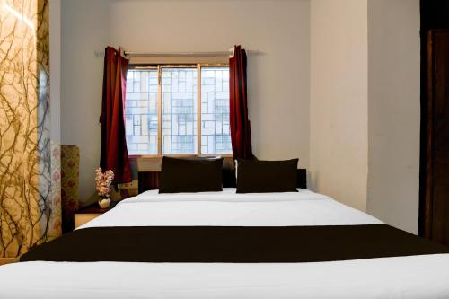 Postel nebo postele na pokoji v ubytování Hotel O Plaza 2.0