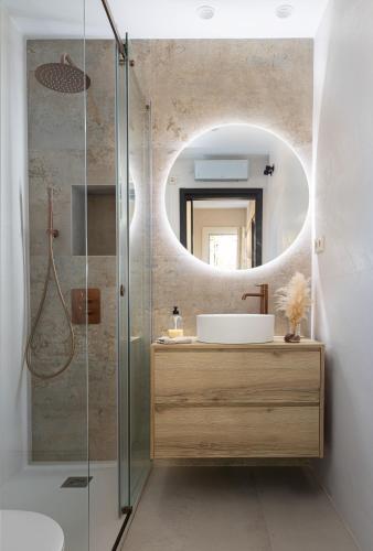 a bathroom with a sink and a mirror at Villa Beach Barcelona in Montgat