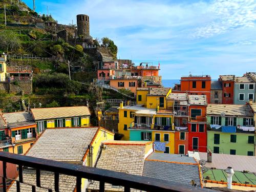 a group of colorful houses on a hill at The Sea Terrace Vernazza in Vernazza