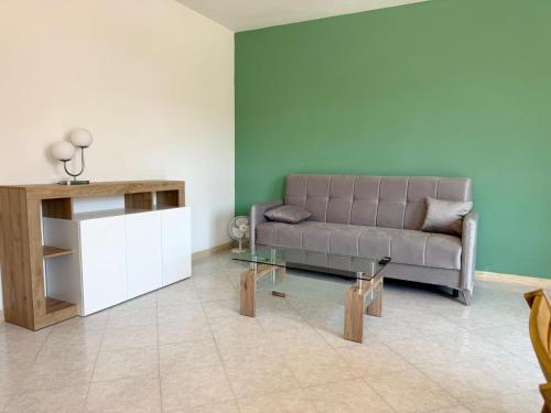 a living room with a couch and a table at Torrenieri House in Torrenieri
