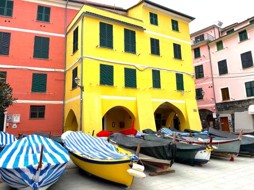 a group of boats parked in front of a building at The Sea Terrace Vernazza in Vernazza