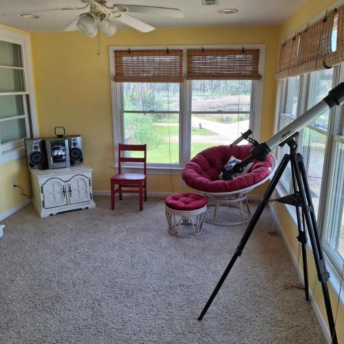 a camera on a tripod in a living room at Little Oyster Oasis in White Stone