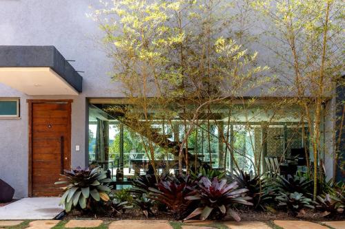 a staircase leading to a house with plants at Casa Versos in Nova Lima