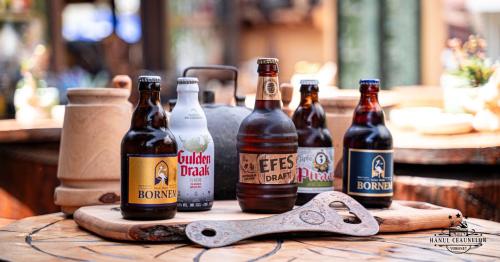 a group of bottles of beer on a table at Hanul Ceaunelor Voronet in Voronet
