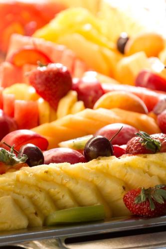 a tray of fruits and vegetables on a table at Mercure Montpellier Centre Antigone in Montpellier