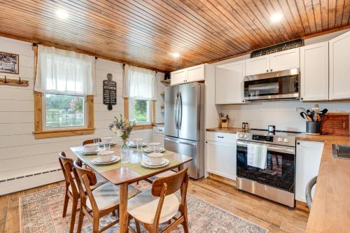 a kitchen with a table and chairs in it at Recently Renovated Harveys Lake Retreat with Dock! in Harveys Lake