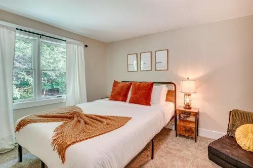 a bedroom with a large bed and a window at Recently Renovated Harveys Lake Retreat with Dock! in Harveys Lake