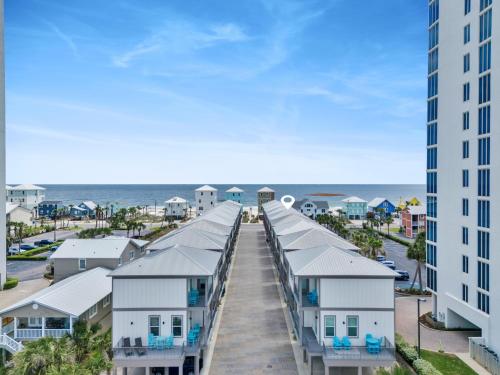 a view of the beach from a building at Little Lagoon Beach House by The Madison Liv Collection in Gulf Shores
