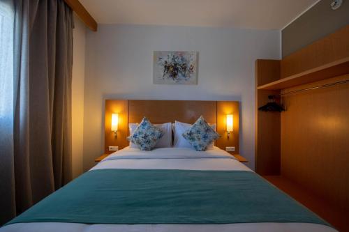 Cama o camas de una habitación en Hôtel La Perle de Mogador