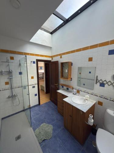 a bathroom with a sink and a shower at Gomera Isla Mágica in San Sebastián de la Gomera