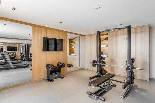 a gym with two treadmills and two tread machines at Villa Kaplankaya in Milas