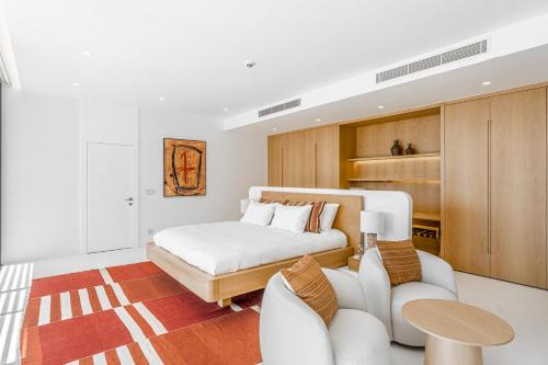 a bedroom with a bed and a table and chairs at Villa Kaplankaya in Milas