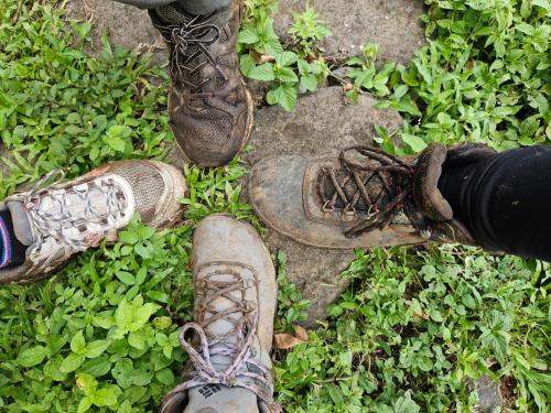 a group of people standing on the ground with their shoes at Eco lodge finca magdalena in Altagracia