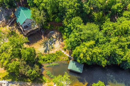 an aerial view of a house in the middle of a river at Lakefront Retreat with Multi-Level Deck and Dock! in Alexander
