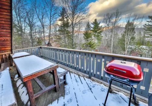 a balcony with a snow covered table and a stool at Triangle Tranquility Unique A Frame 6 BR Home in Lanesville