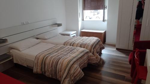 Postel nebo postele na pokoji v ubytování Cozy!! Verona