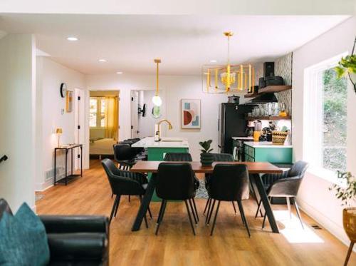 a kitchen and dining room with a table and chairs at The Greenhouse with Indoor Slide close to Hocking Hills in South Bloomingville