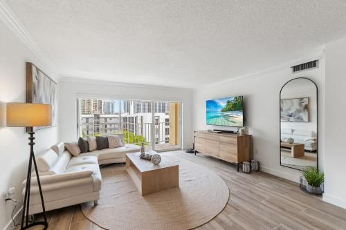 a living room with a couch and a table at 2BR-2BA with Pool Gym Beach Marbella Tower in Sunny Isles Beach