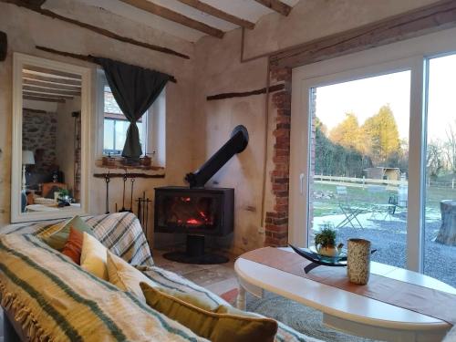 Zona de estar de La Source de nos Racines, Gîte de caractère