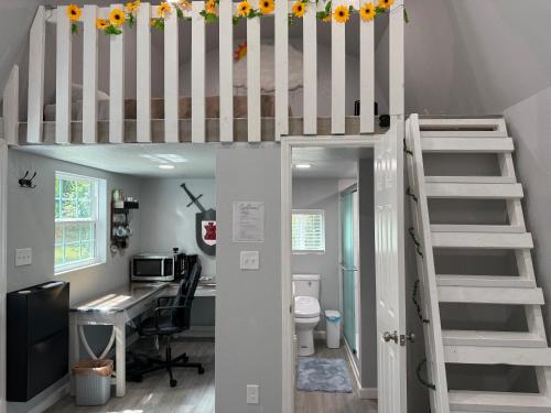a room with a desk and a loft bed at Tiny house with smart bidet and water purify-system in Gastonia
