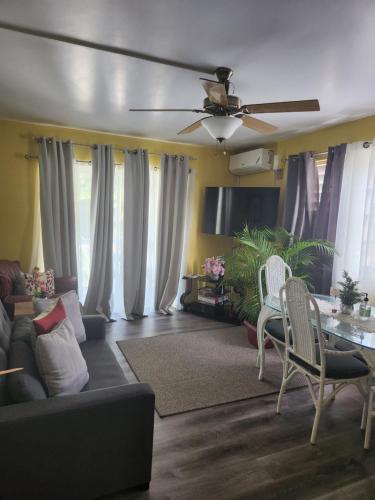 a living room with a couch and a table at Relaxing Space with an Awesome View in Lodge