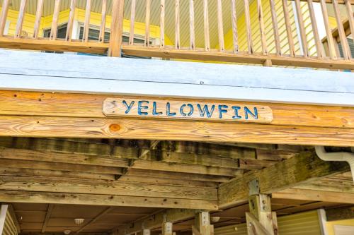 a wooden sign that says yellowkun on a building at Yellowfin in Buxton