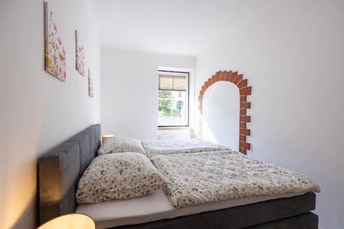 a bedroom with a bed and a window at Steinmetz-Haus in Mariazell