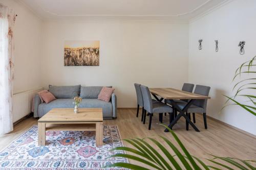 a living room with a couch and a table at Steinmetz-Haus in Mariazell