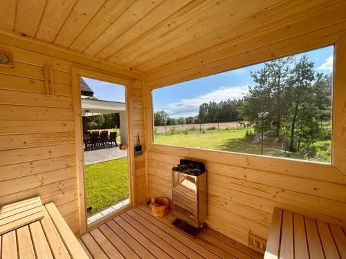 Φωτογραφία από το άλμπουμ του Domek wypoczynkowy Wiec - Sauna & Balia σε Nowy Wiec