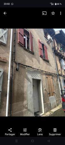 a picture of a building with windows and a door at LE PETIT PRINCE du DESERT in Moissac