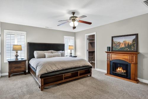 a bedroom with a bed and a fireplace at Cozy Desert Retreat Near Zion - Patio Dininggrill in La Verkin