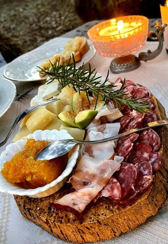 a plate of food sitting on top of a table at Azienda Agricola Veldidonna in Aggius