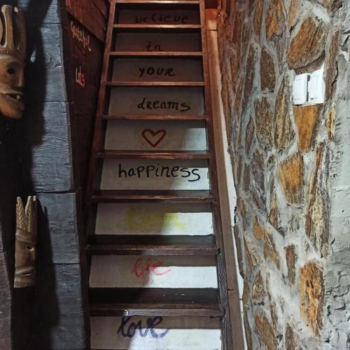 a staircase with a sign that says youre dreams happiness at Miliceva ruza in Zlatibor