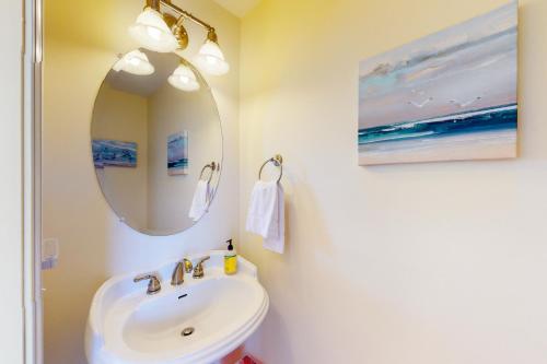 a bathroom with a sink and a mirror at Sea Nine #C9SC-H in Hatteras