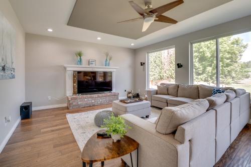 a living room with a couch and a fireplace at Private Hot Tub Home Near Moses Lake Access in Moses Lake