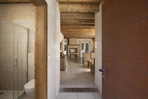 a hallway leading to a bathroom with a toilet at Villa Nocciola with Sea View, Private Pool and Sauna in Premantura