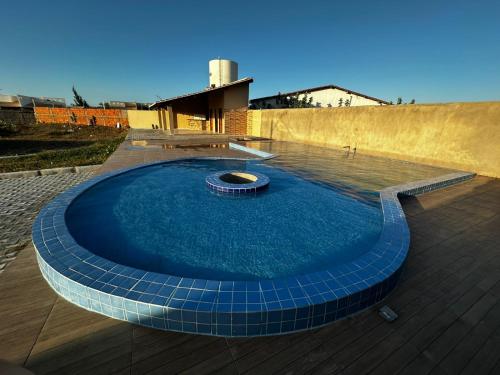a large pool of water with a fountain in the middle at Casa praia beach place in Luis Correia