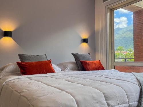 Ένα ή περισσότερα κρεβάτια σε δωμάτιο στο Nomad Suites Altamira